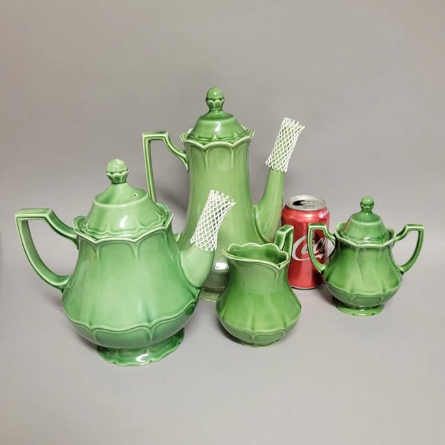 A luminous four-piece English ironstone service in Johnson Brothers’ sculptural “Jade Green” glaze. The set includes a...