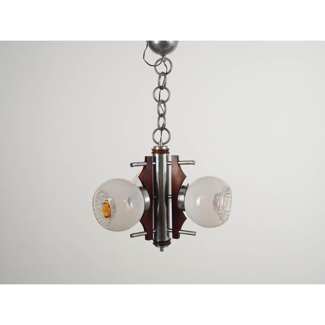 The lamp was made in the 1970s, Italian production. Made of metal, wood and Murano glass. The unique construction is not...