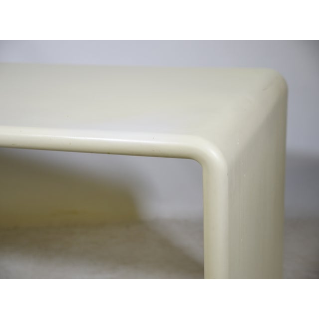 Space Age nesting tables/desks made of fiberglass, 1970s, set of two. Softly rounded frames in cream-white fiberglass with...