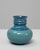 This 20th Century German turquoise ceramic vase features a soft, rounded silhouette paired with a subtly sculpted neck,...