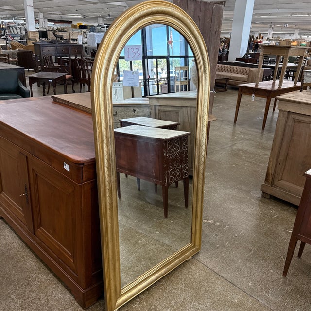 (Pair Available) This is a beautiful Vintage French Louis Philippe Giltwood Mirror, featuring the iconic arched top that...