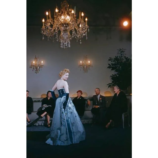 Fashion At Hartnell’s 1955 A fashion show at the Burton Street salon of British couturier and court dressmaker Norman...