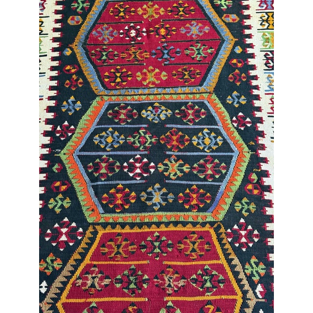 An antique Eastern Turkish wool kilim rug from Anatolia region circa 19th century. The finely woven rug is professionally...