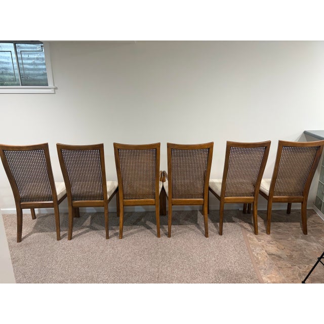 This is a beautiful set of MCM cane back dining chairs by Drexel Heritage. They feature a comfortable high back design,...