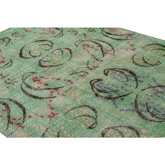 Hand-knotted in wool and originating from Turkey circa 1960 – 1970, this 6x8 vintage Zeki Müren rug is a unique addition...
