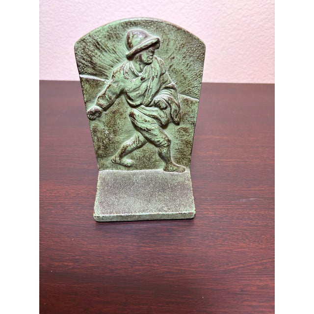 What a formidable WWII era soldier depicted in these metal bookends stamped with a serial number 71 on the inside. The...