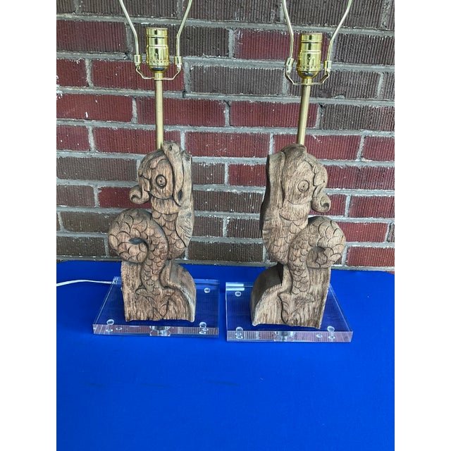 Pair Antique French Dolphin Architectural Fragment Lamps w/Lucite Bases in good estate condition. The oak dolphins are...