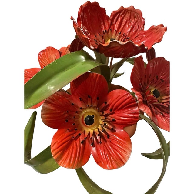 A charming, vintage tole floral arrangement. Features hand painted blooms in shades of red with yellow highlights and...