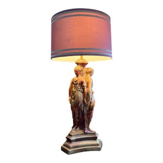 1950 Hollywood Regency Gold Bronze Tone "Three Graces" Heavy Lamp. Purple Silk Shade. Base 34”x12”. Shade 10”x16”. Style of Tony Duquette For Sale