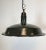 Industrial hanging light made in the 1950s. Dark grey enamel. White interior. Iron top. New porcelain socket for E27 light...