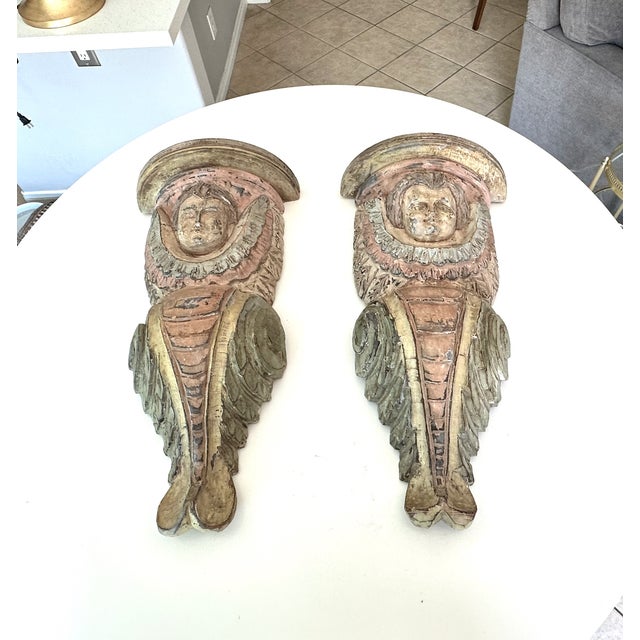 Pair of vintage 1960's hand carved wooden polychrome cherub wall bracket shelves, reminiscent of 19th century Continental...