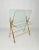Magazine rack stand in a brass and glass structure which can also be used as a table as it features a glass shelf. Made in...