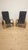 A distinctive mid-century armchairs from Czechoslovakia, featuring a sculptural wooden frame, curved armrests, and a woven...