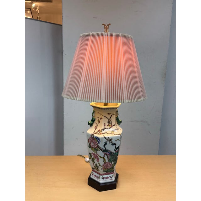Design Plus Gallery presents a Famille Rose Table Lamp. The lamp has a hand painted porcelain body and rest of an...