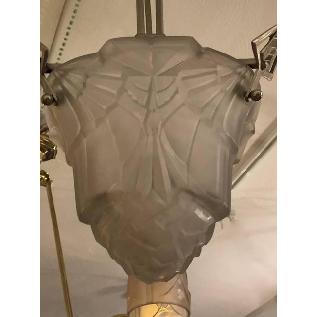 Very elegant French Art Deco chandelier having one large centerpiece of glass surrounded by three tulips. Molded glass...