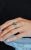 This is part of Chairish’s Fine Jewelry assortment. Three Stone Genuine Emerald Ring with Halo Diamond Set in 18K Gold...