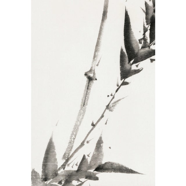 A striking example of minimalist Japanese brush painting, this vintage art print reproduction features a delicate bamboo...