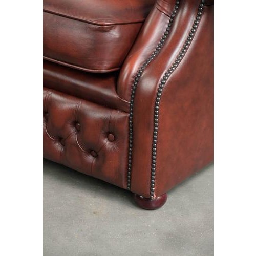 Cowhide Chesterfield Armchair in a Warm Brown Color Scheme For Sale - Image 10 of 13