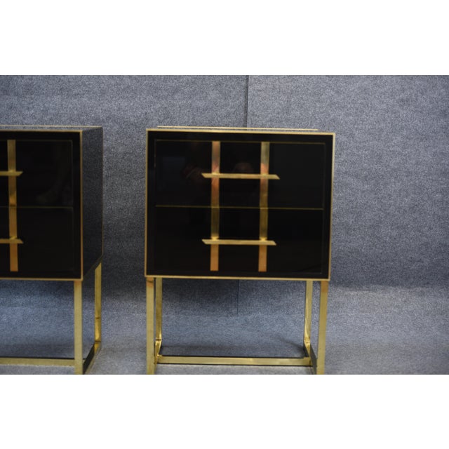 The nightstand with its black glass surface conveys a feeling of freshness and elegance. On its vertical sides, fine brass...