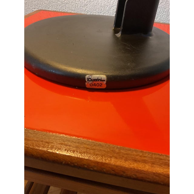 This Italian 1970s Vintage black adjustable desk lamp by Guzzini , features a distinctive mid-century modern, or “space...