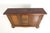 A Baroque style carved sideboard / credenza with generous bun feet. The cabinet has a nicely carved front panel depicting...