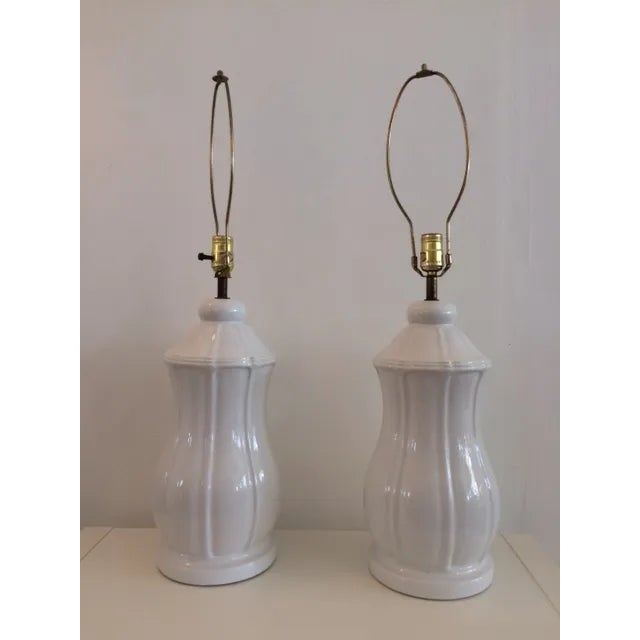A very special pair of vintage Hollywood Regency Blanc ceramic table lamps . This is a one of kind hand made set. A great...