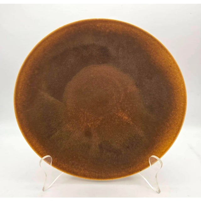Offered is a mid 20th Century matte glazed caramel-colored bowl created by Lietzke Porcelains, the pottery studio of...