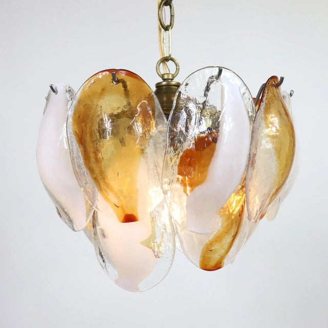 This Postmodern Murano glass light fixture by La Murrina features two tiers of cristallo glass shells with amber and white...