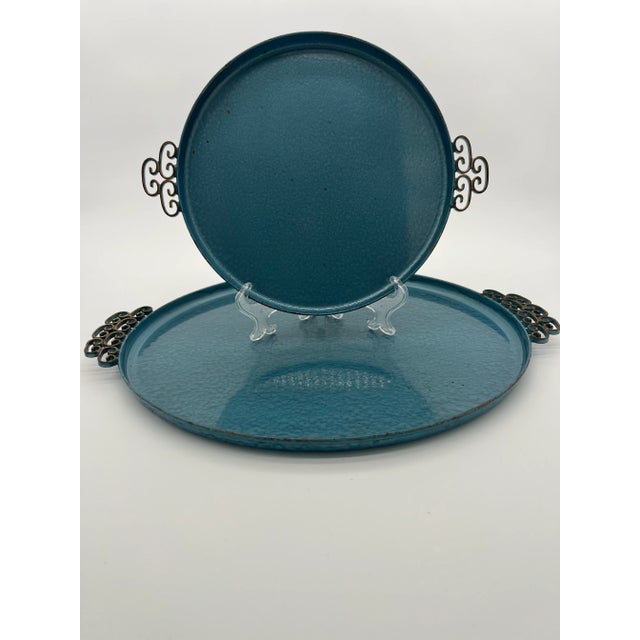 Blue moire glazed trays by the Kyes company. These vintage beauties are made of metal. Set includes two trays, the small...