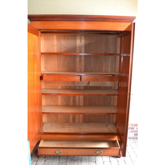 19th-century Dutch mahogany maid's cabinet. The height is 199 cm. The width is 135 cm. The depth is 48 cm. Fully...