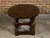 An English Georgian period pine table from the 18th century with oval top, turned legs and side stretchers. This exquisite...
