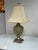 Design Plus Gallery presents a Hollywood Regency Lattice Ceramic Table Lamp. It has a sage green glazed body in an urn...