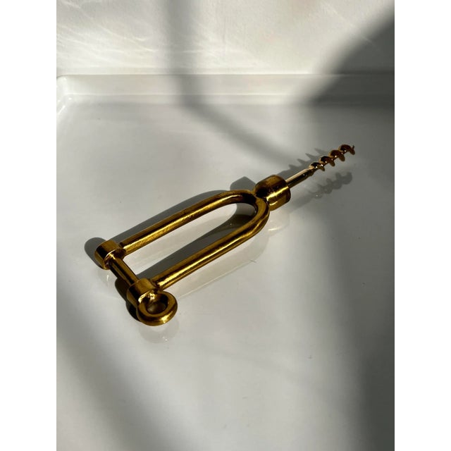 A nautical themed corkscrew for opening wine bottles. It is made of solid brass and depicts a Long Dee boat shackle. The...
