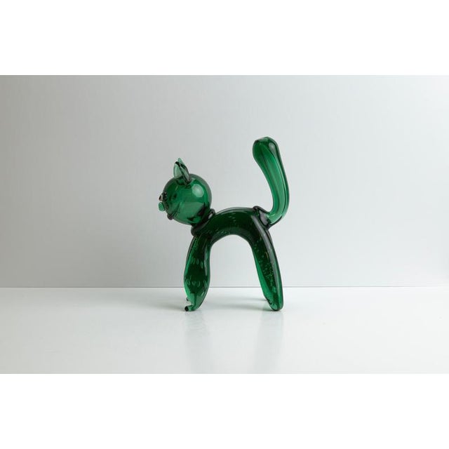 A Vetro Verde glass cat sculpture by Toso et Bagnoli, hand-crafted in the Empoli region of Italy during the 1950s....