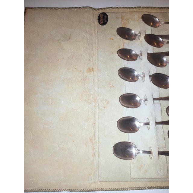 A beautiful and refined vintage set of 12 coffee or tea spoons, dating back to the 1960s. The spoons feature a classic and...