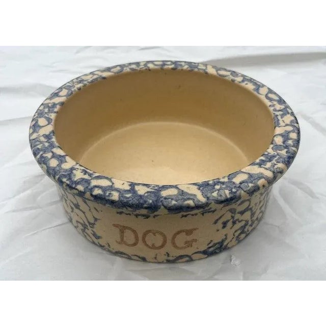 This sponge ware pottery "DOG" dish in a yellow ware pottery format.The condition is very good.Signed Roseville,Ohio and...