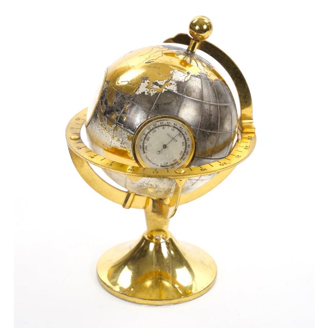 An elegant mid-20th-Century globe-form desk clock and weather station by Tiffany & Co., dating to circa 1960. Combining...
