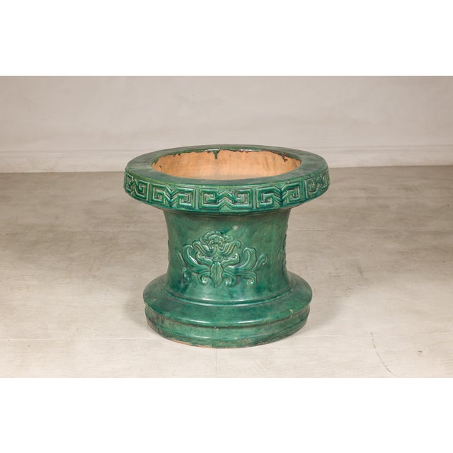 This vintage Chinese ceramic form features a rich emerald-green glaze and a bold silhouette that allows it to function...