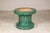 This vintage Chinese ceramic form features a rich emerald-green glaze and a bold silhouette that allows it to function...