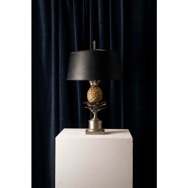 An elegant and decorative table lamp attributed to the French firm Maison Charles, made in France circa 1960s-70s. This...