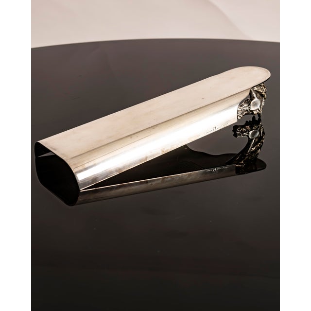 An elegant desk accessory produced by Hermès Paris in France during the 1960s. The piece features an elongated tray made...