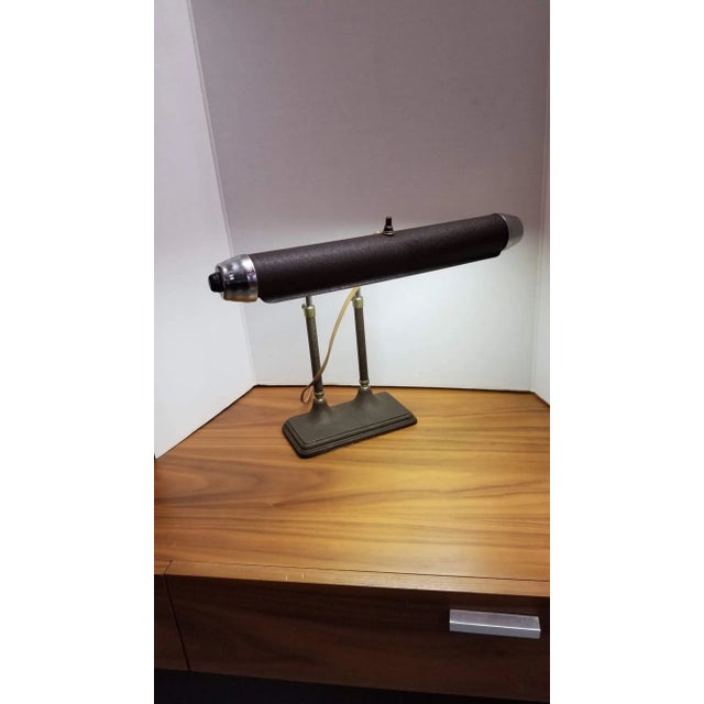 Art Deco fluorescent Brown/Grey enameled desk table lamp with streamline shaped body and Machine Age styled chrome cap...