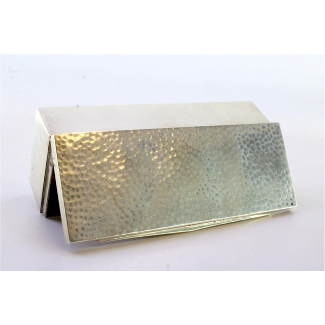 Hammered Silver Snuff Box with Application and Gilt Interior, in Very Good conditions. Designed 1920 to 1949 This piece...