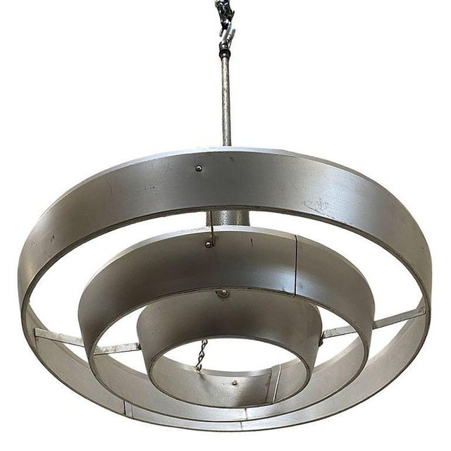 Pair of Kurt Versen designed the "Saturn" ceiling lights, both featuring a stacked aluminum ring light shade suspended by...