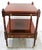 This 1980s Bombay Regency Style Cherry Finish Two Tier Side End Table is a stylish and functional piece of furniture for...