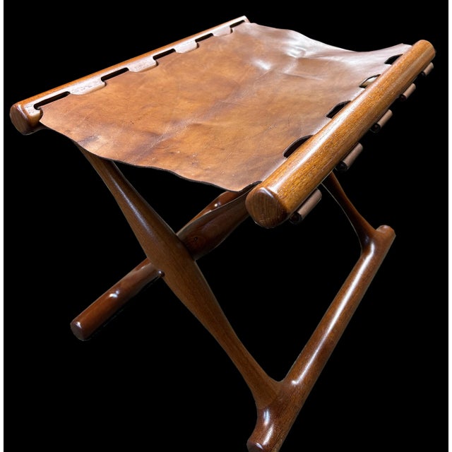 It's so rare to find one of these beautiful stools in original condition, original leather still with it's label beneath !...