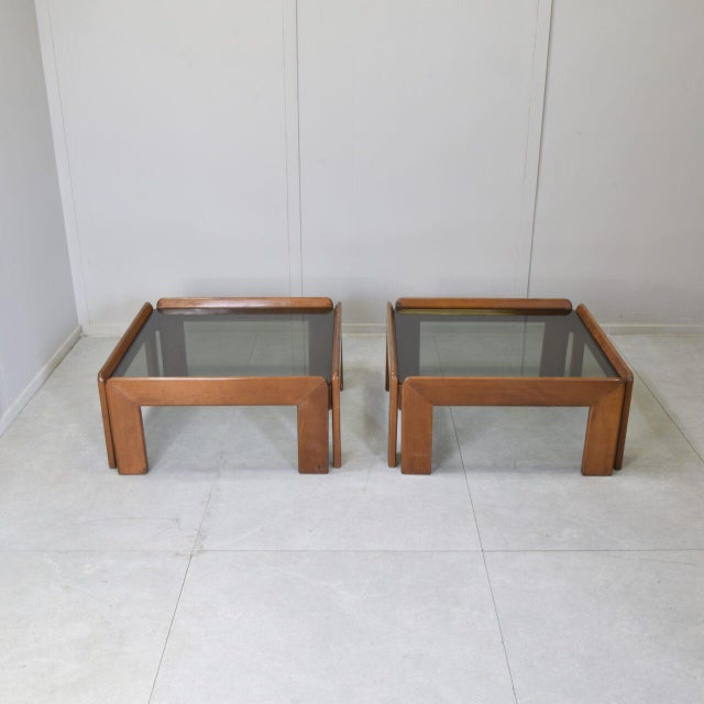 Pair of square solid wood coffee tables with smoked glass shelves by Afra and Tobia Scarpa for Cassina The frame is made...