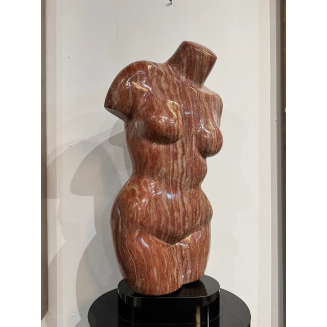 An exceptional Italian marble sculpture of a female torso, signed E.H.B. 80 on the base. Hand-carved from richly veined...