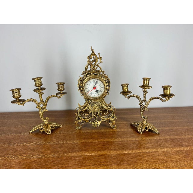 Elevate your home décor with this exquisite vintage-style brass mantel clock and matching candelabra set, crafted in an...