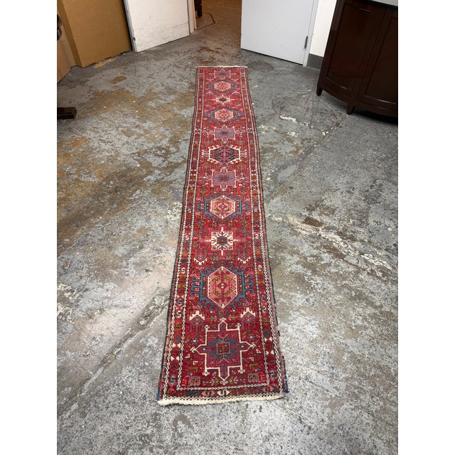 Design Plus Gallery presents a 1ft 10in × 12ft Karajeh Heriz Persian Rug, Circa 1930s. This hand knotted runner presents a...